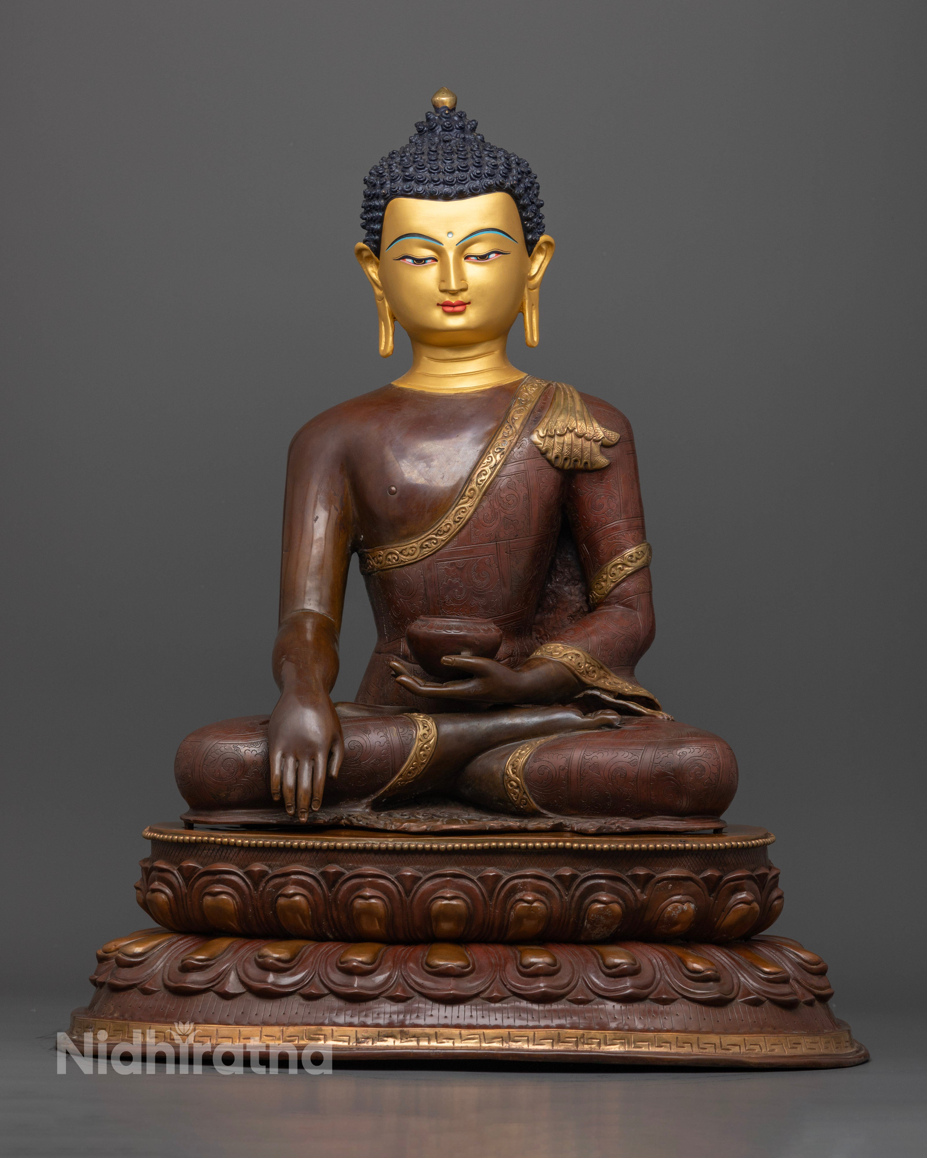 Handcrafted Buddha Shakyamuni statue from Patan, Nepal, standing 52cm tall and 42.5cm wide, made from oxidized copper with a radiant 24k gold-plated face and vibrant acrylic colors.