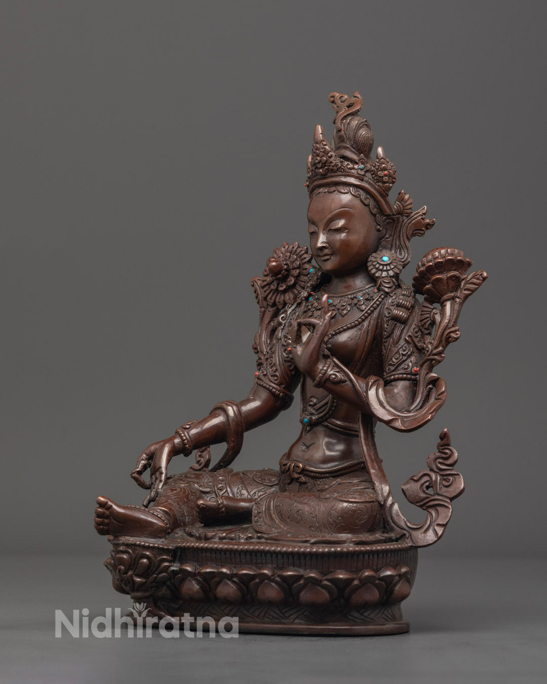 Handcrafted Green Tara statue made with traditional lost wax technique, highlighting jewelry and facial details