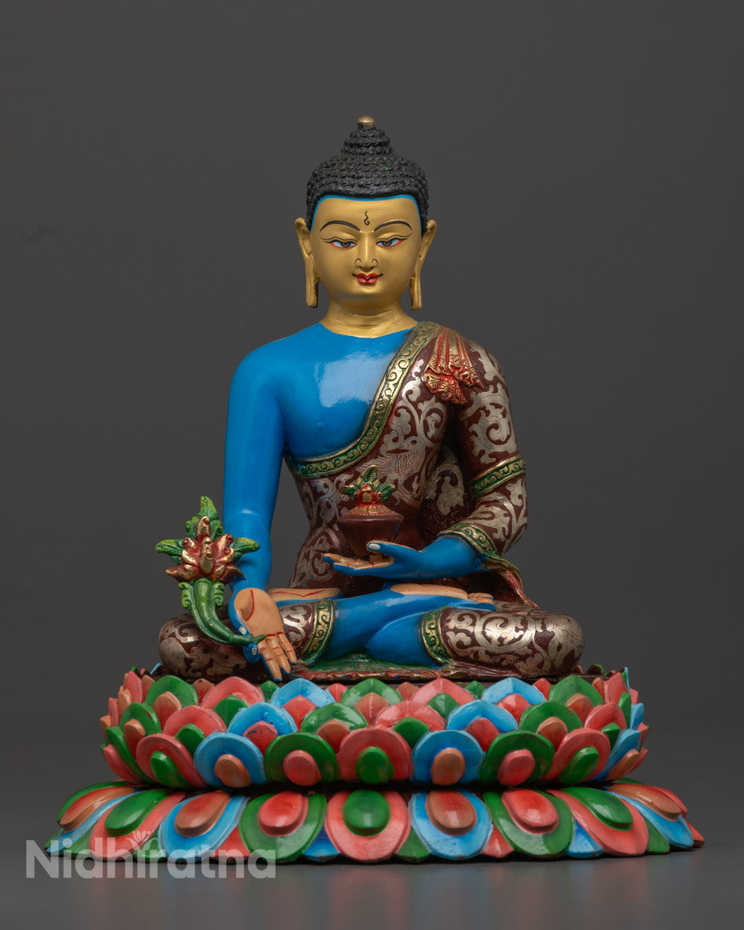 Handcrafted Healing Medicine Buddha Statue with gold-gilded face and blue body symbolizing peace and spiritual healing