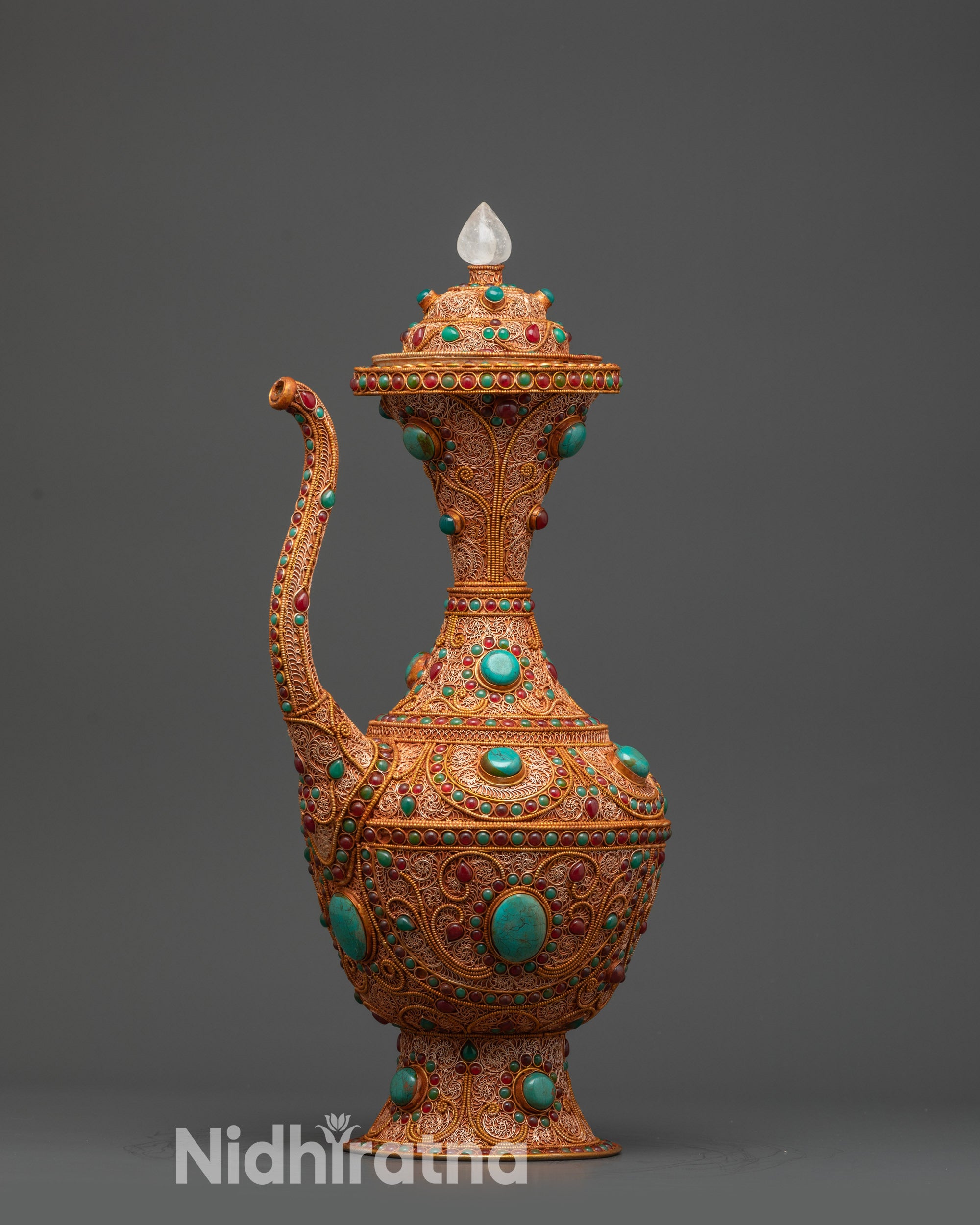 Handcrafted Himalayan Copper Karuwa with gold-plated filigree patterns and semi-precious stones