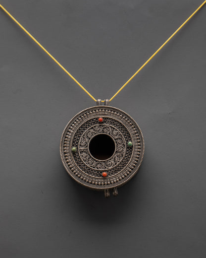 Handcrafted Mandala Locket from Patan, Nepal, displayed on a dark background highlighting