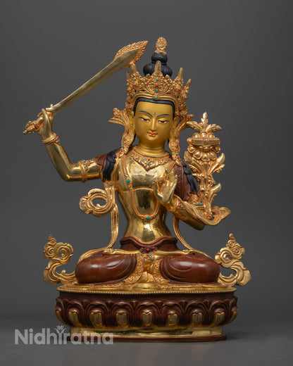 Handcrafted Manjushri Bodhisattva statue with gold-gilded face and fire gold on copper alloy.