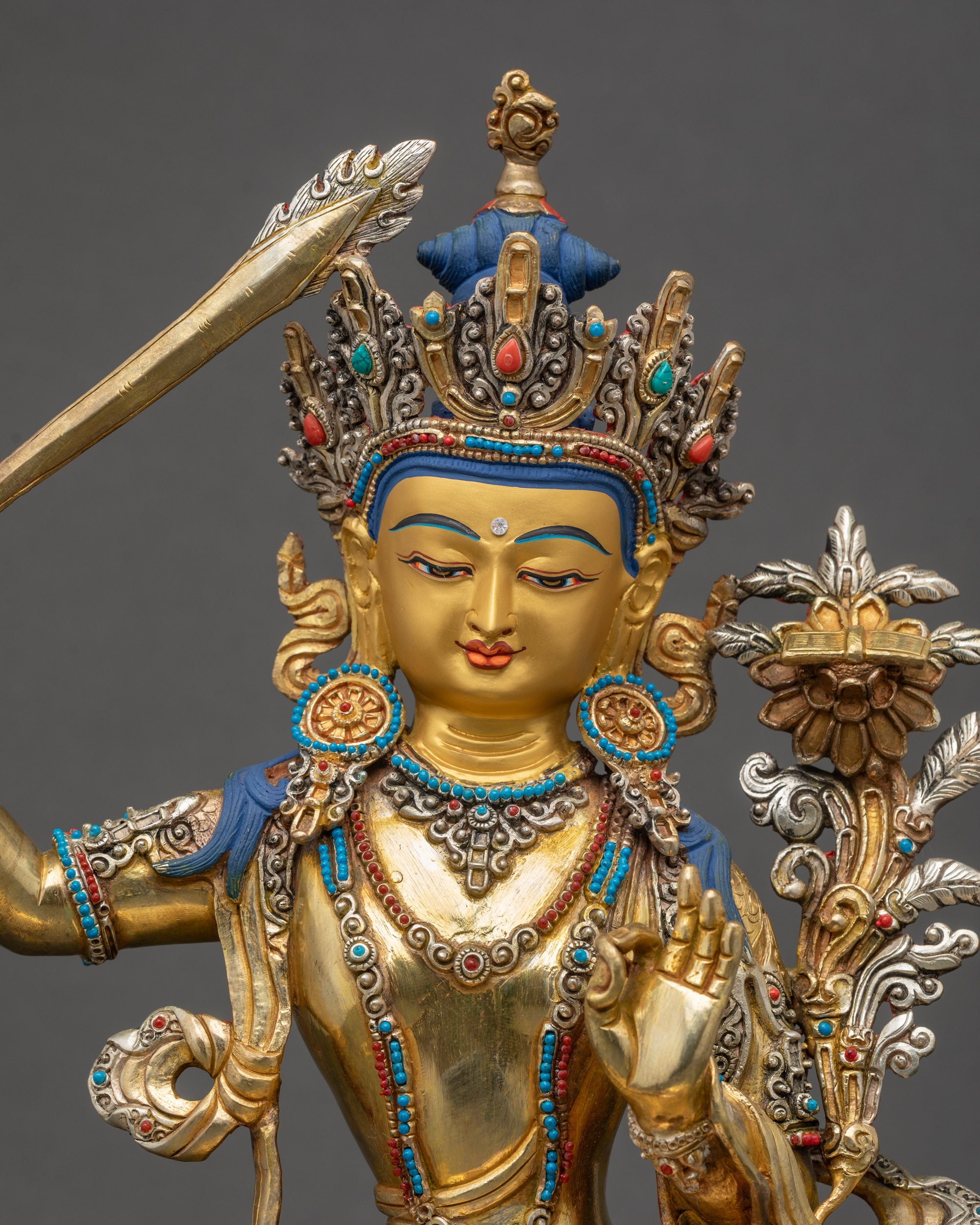 Handcrafted Manjushri Statue close up showing gold-gilded details and robes