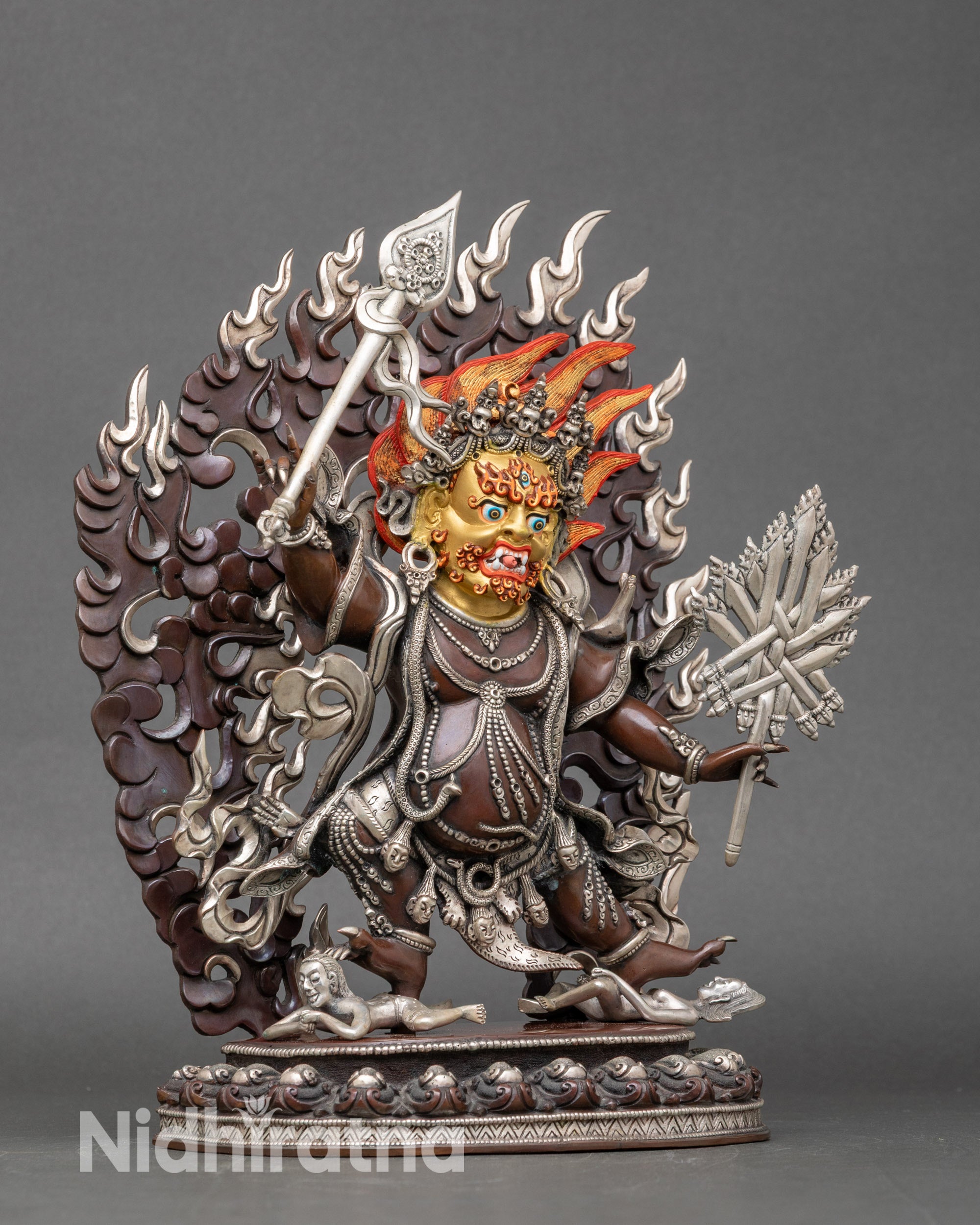 Handcrafted Nepalese Talka Mebar sculpture showing ritual implements and protective pose