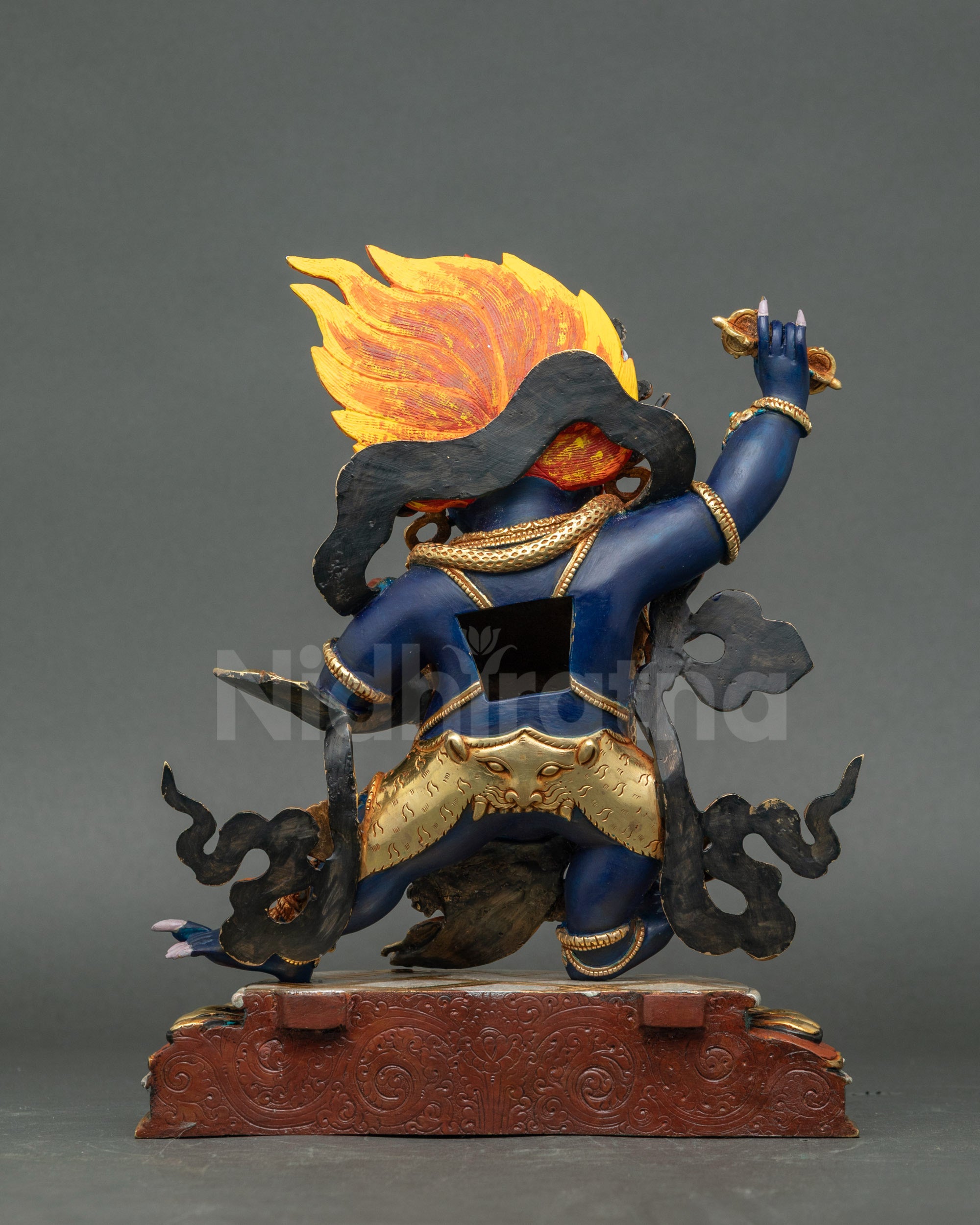 Handcrafted Nepalese Vajrapani Chagna Dorje statue with wrathful expression and halo.
