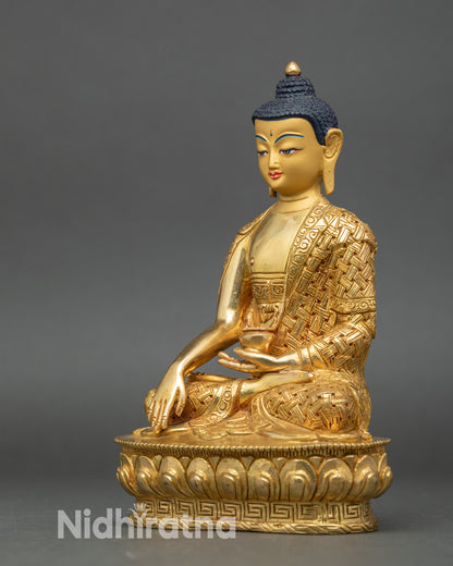 Handcrafted Nepalese copper Buddha statue with intricate robe patterns and sacred presence