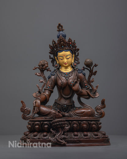 Handcrafted Oxidized Green Tara Statue with 24K gold-gilded face, seated in Lalitasana on a lotus throne, displaying Varada Mudra.