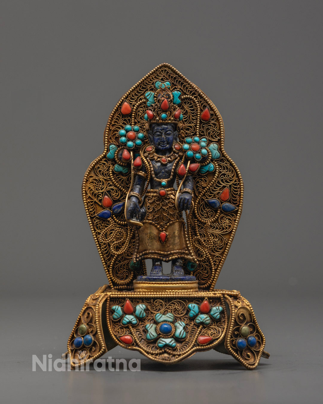 Handcrafted Padmapani statue made from blue precious stones with intricate detailing and serene expression