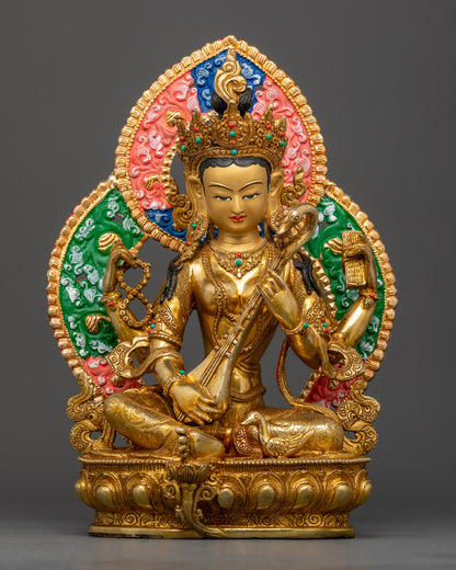 Handcrafted Saraswati statue from Nepal, gold fire-gilded with 24K gold face