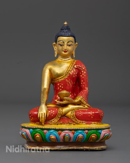 Handcrafted Shakyamuni Buddha Statue with gold-gilded face and vibrant hand-painted acrylic details on a copper body, made using the sacred Lost Wax technique by Nepalese artisans
