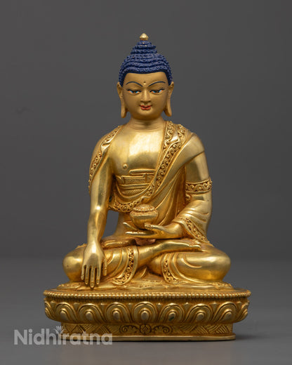 Handcrafted Shakyamuni Buddha sculpture from Nepal in 24k gold-gilded copper, seated in serene meditation on a lotus throne