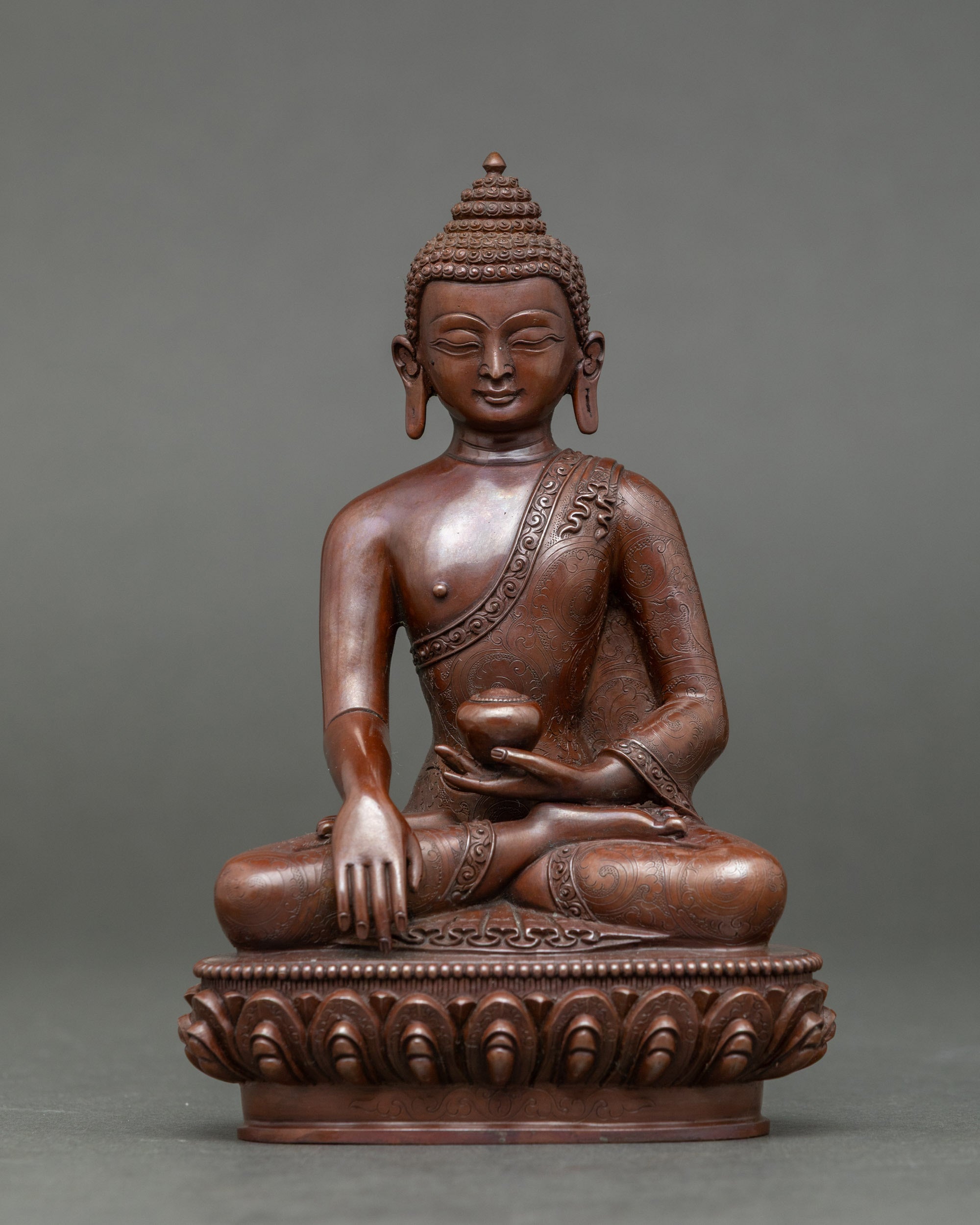 Handcrafted Shakyamuni Buddha sculpture with oxidized finish seated on lotus throne
