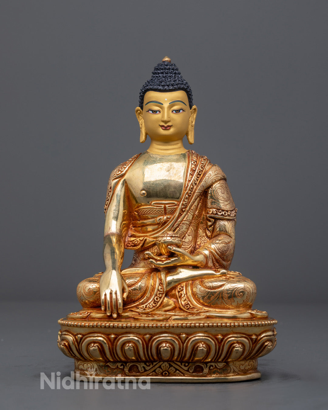 Handcrafted Shakyamuni Buddha statue with 24k gold gilding on copper base, made in Nepal using traditional lost wax method
