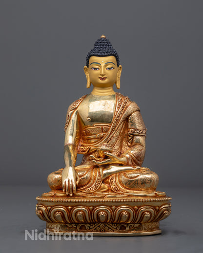 Handcrafted Shakyamuni Buddha statue with 24k gold gilding on copper base, made in Nepal using traditional lost wax method