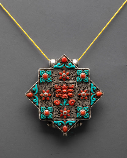 Handcrafted Tibetan Flower Amulet Locket front view with silver body and coral turquoise stones