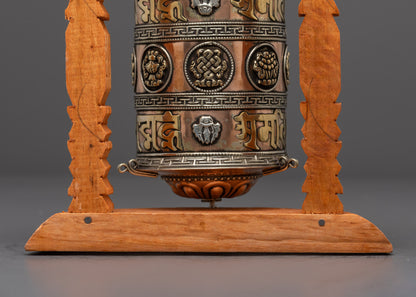 Handcrafted Tibetan Mantra Prayer Wheel with detailed wooden frame and spiritual engravings