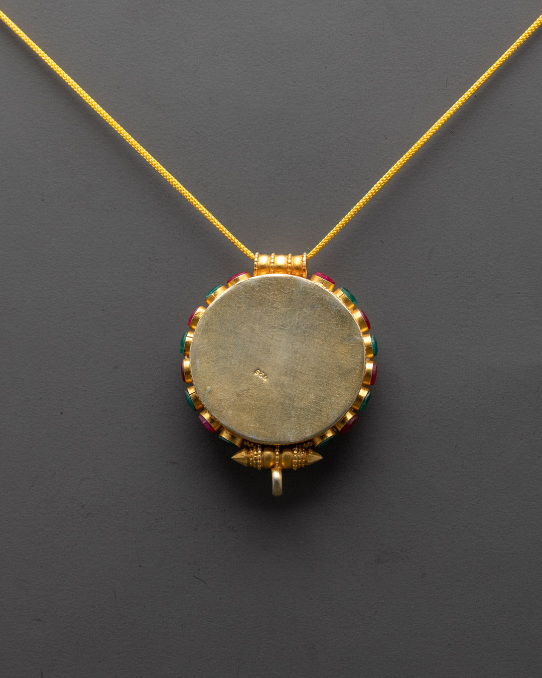 Handcrafted Tibetan prayer pendant adorned with semi-precious stones from Patan, Nepal