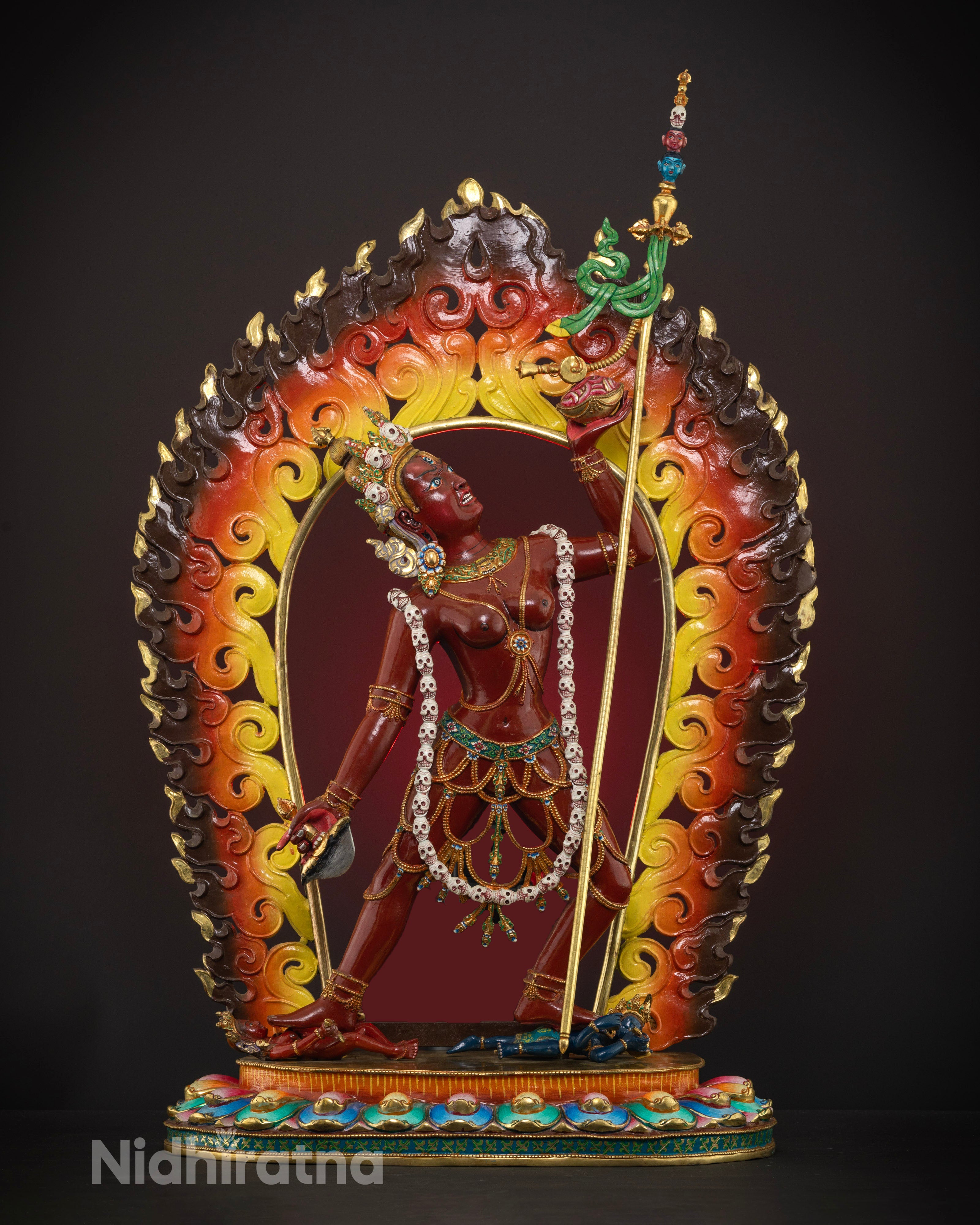Handcrafted Vajrayogini statue made from high-quality copper, featuring a dramatic fire backdrop, vibrant acrylic colors, and an intense expression with a third eye symbolizing fierce wisdom.