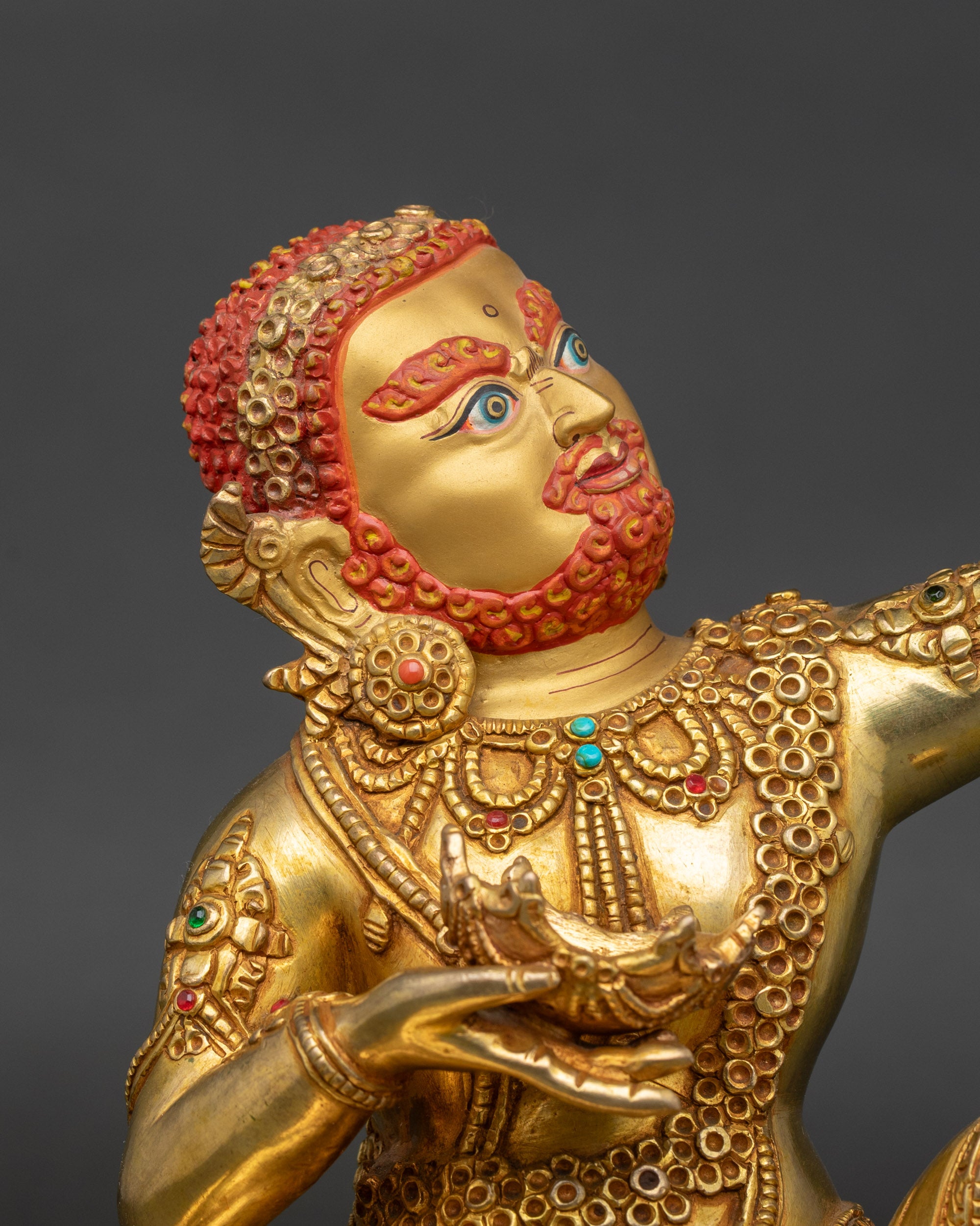 Handcrafted Virupa statue close-up of copper body and gold fire-gilded finish