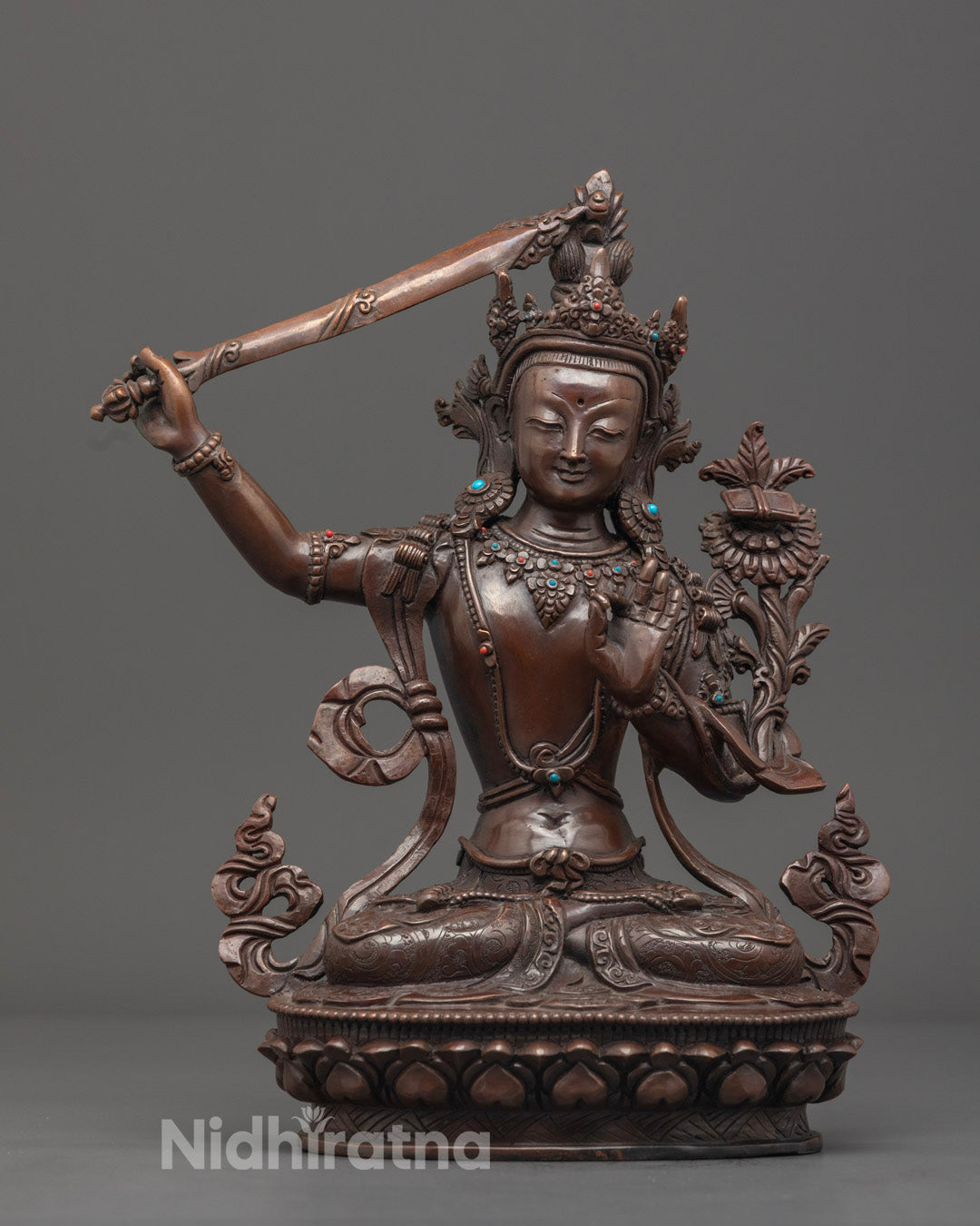 Handcrafted oxidized Manjushri statue made from premium copper with semi-precious stones and detailed carvings on robe and crown