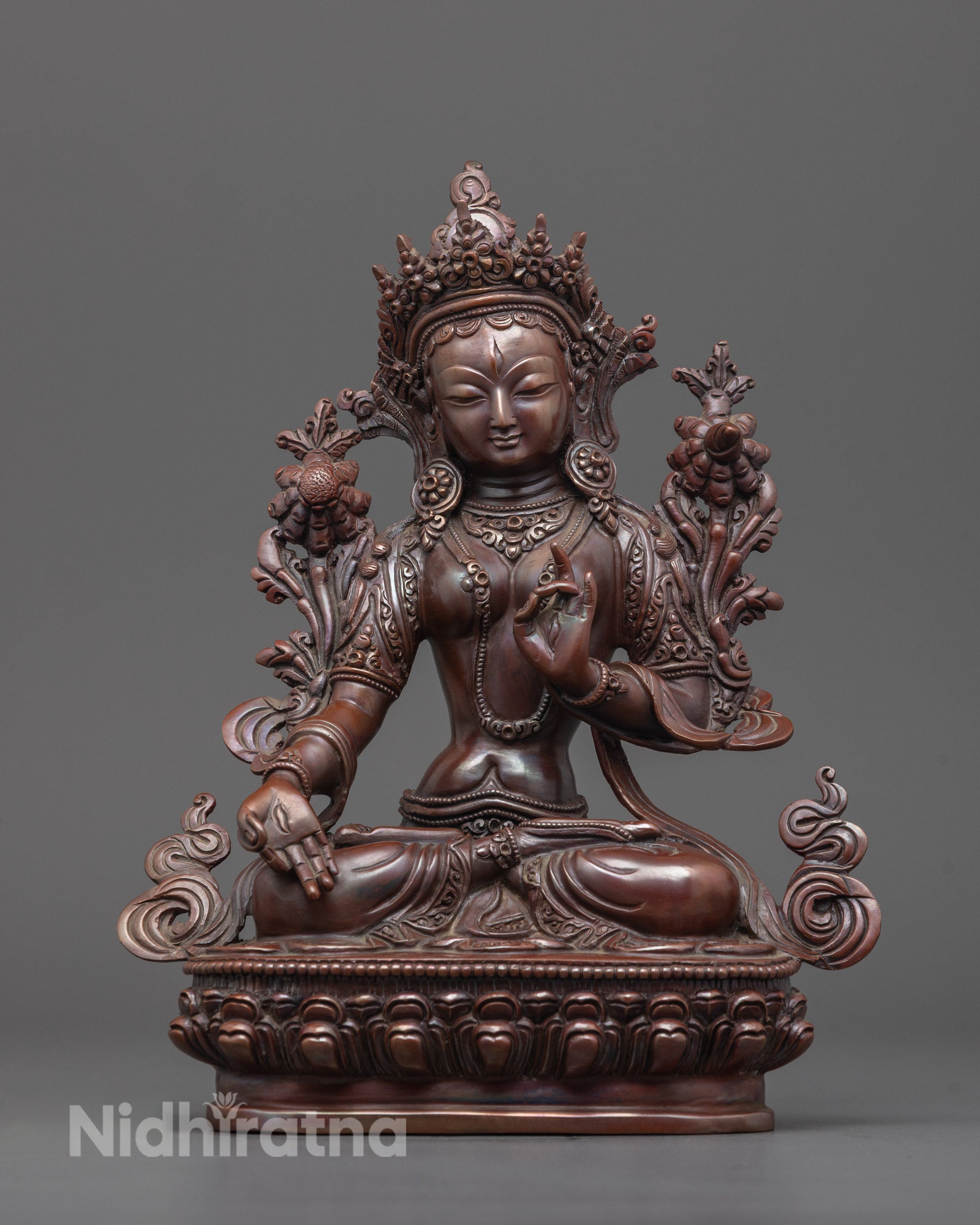 Handcrafted oxidized White Tara statue with utpala flower and varada mudra