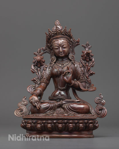 Handcrafted oxidized White Tara statue with utpala flower and varada mudra