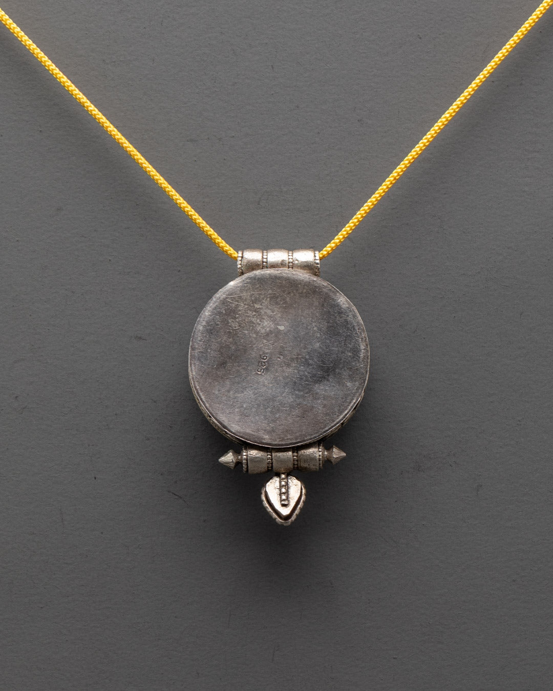 Handcrafted silver shell locket with intricate filigree design
