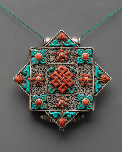 Handmade Tibetan Endless Knot Locket Necklace featuring turquoise and coral semi-precious stones