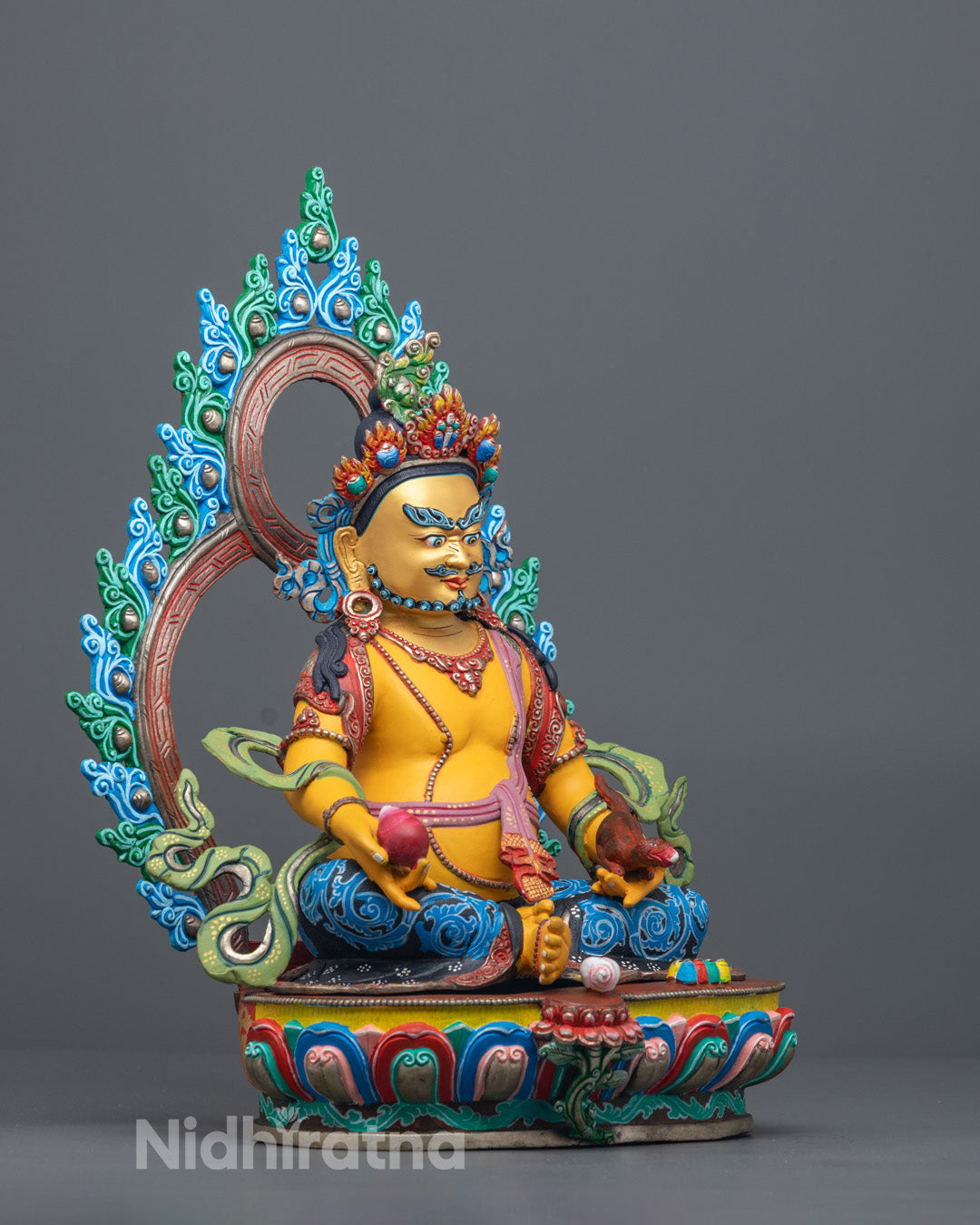 Handmade copper Dzambhala sculpture featuring intricate five-jeweled crown, ornate jewelry, flowing robe, and radiant halo