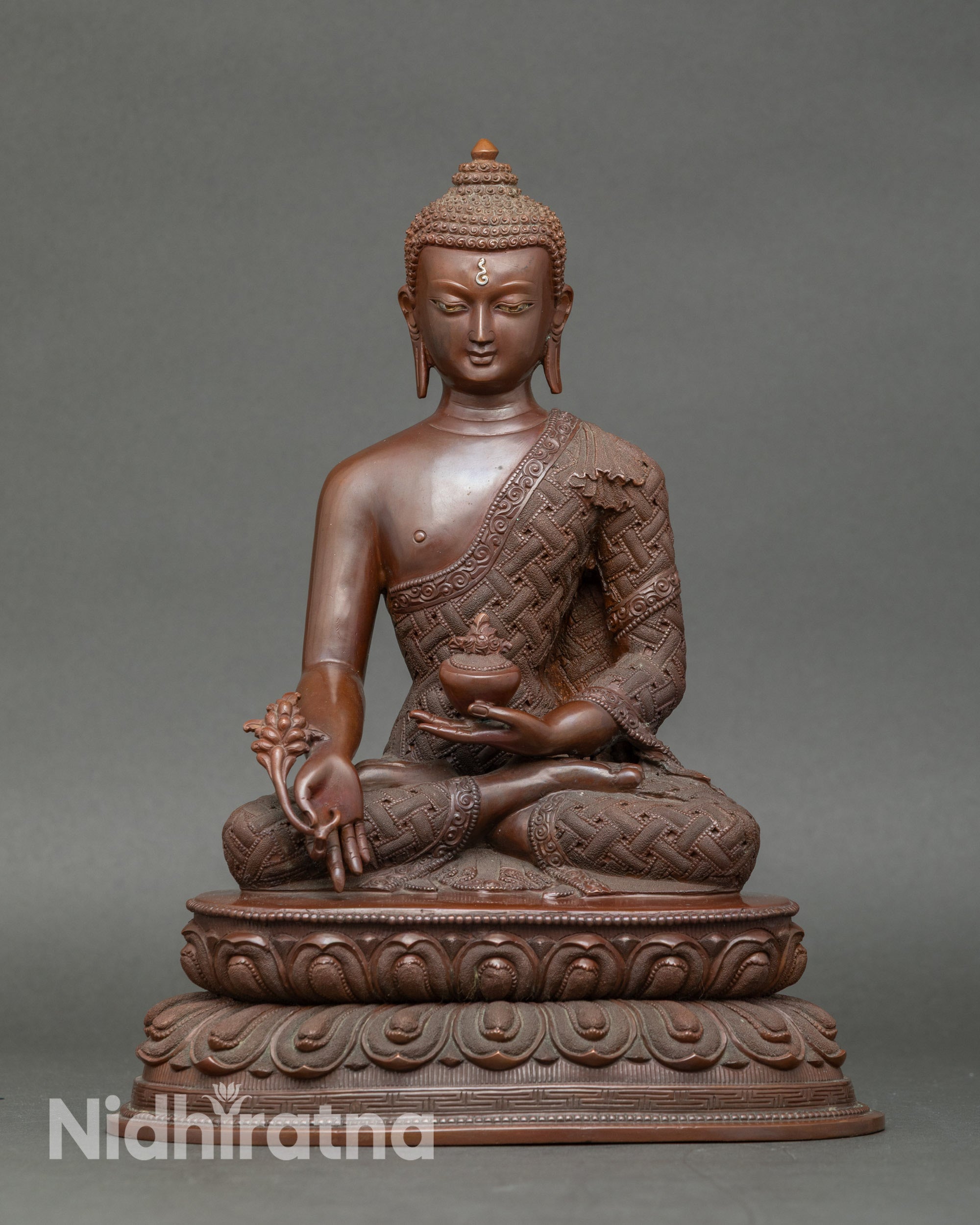 Healing Buddha statue seated on lotus throne, handcrafted Nepalese copper sculpture