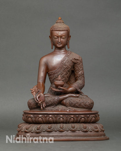 Healing Buddha statue seated on lotus throne, handcrafted Nepalese copper sculpture