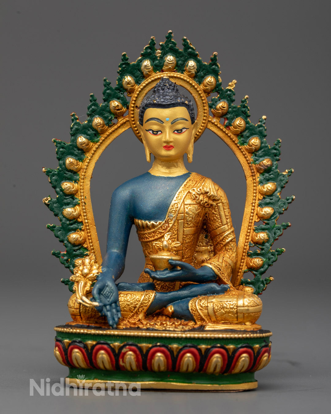 Healing Medicine Buddha Sculpture with gold-plated face and vibrant acrylic-painted body representing traditional Tibetan healing art