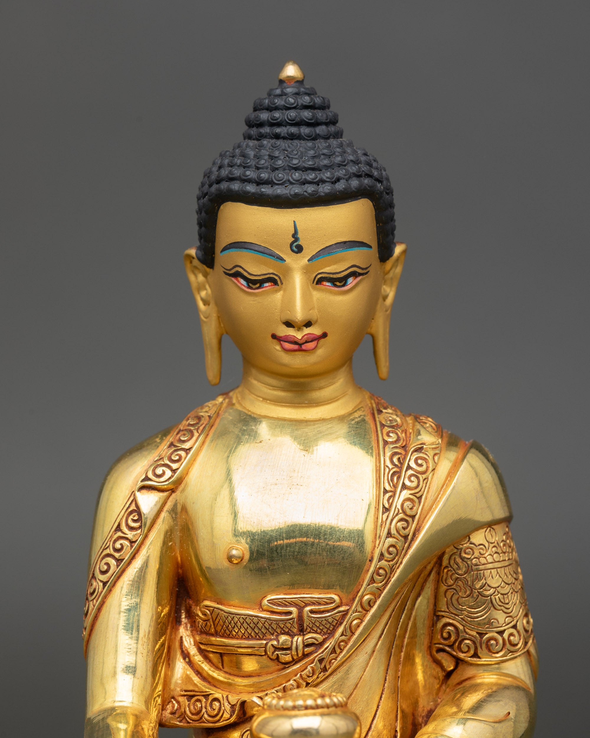 Himalayan Buddha sculpture holding monk’s bowl representing renunciation and mindfulness