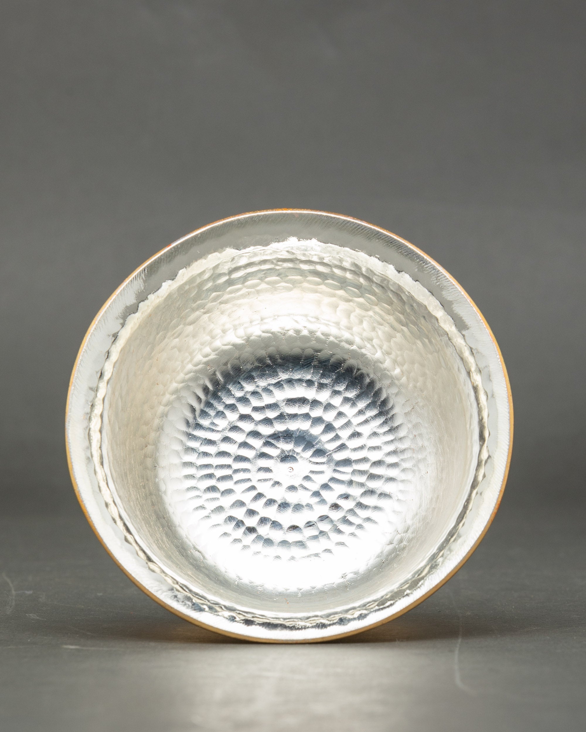 Inside view silver-plated water offering bowls showing smooth ritual interior