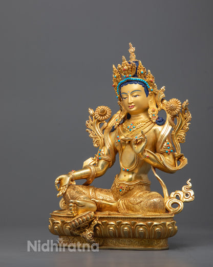 Intricate carvings on the back of Green Tara statue showcasing expert craftsmanship and gold gilding
