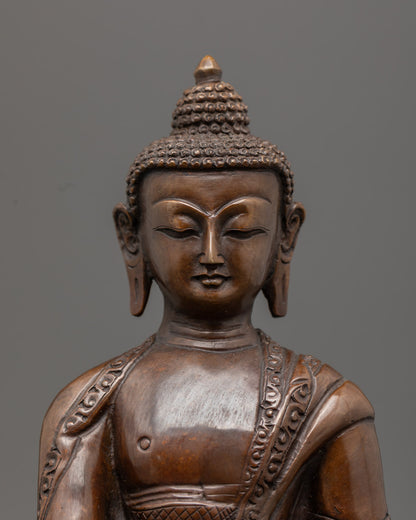 Intricately detailed Amitabha Buddha statue made using the lost wax method, featuring oxidized copper and gold gilded face, painted with acrylic colors.