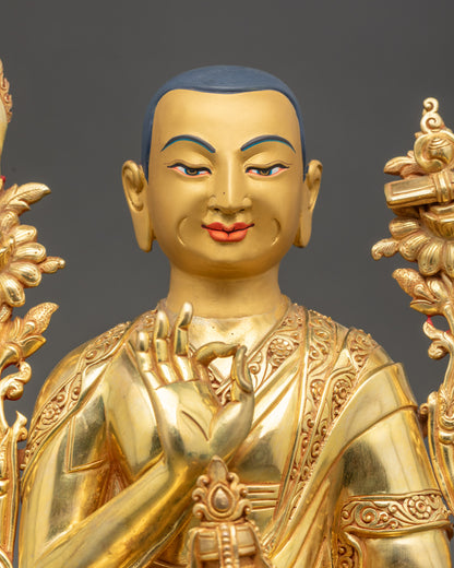 Je Tsongkhapa statue holding Kalash with utpala flowers and flaming sword