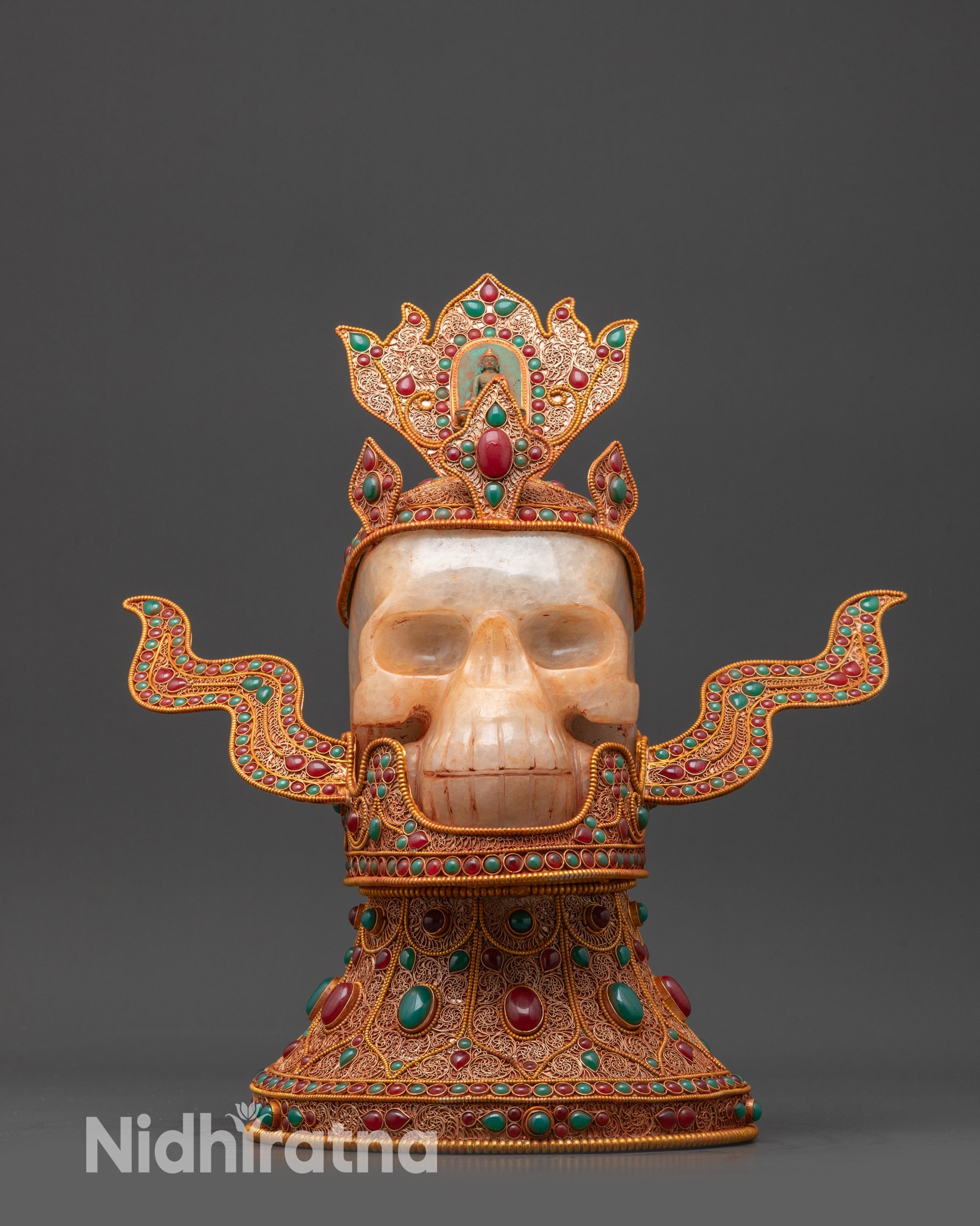 Jeweled Skull Head front view handmade in Nepal with coral and turquoise inlays