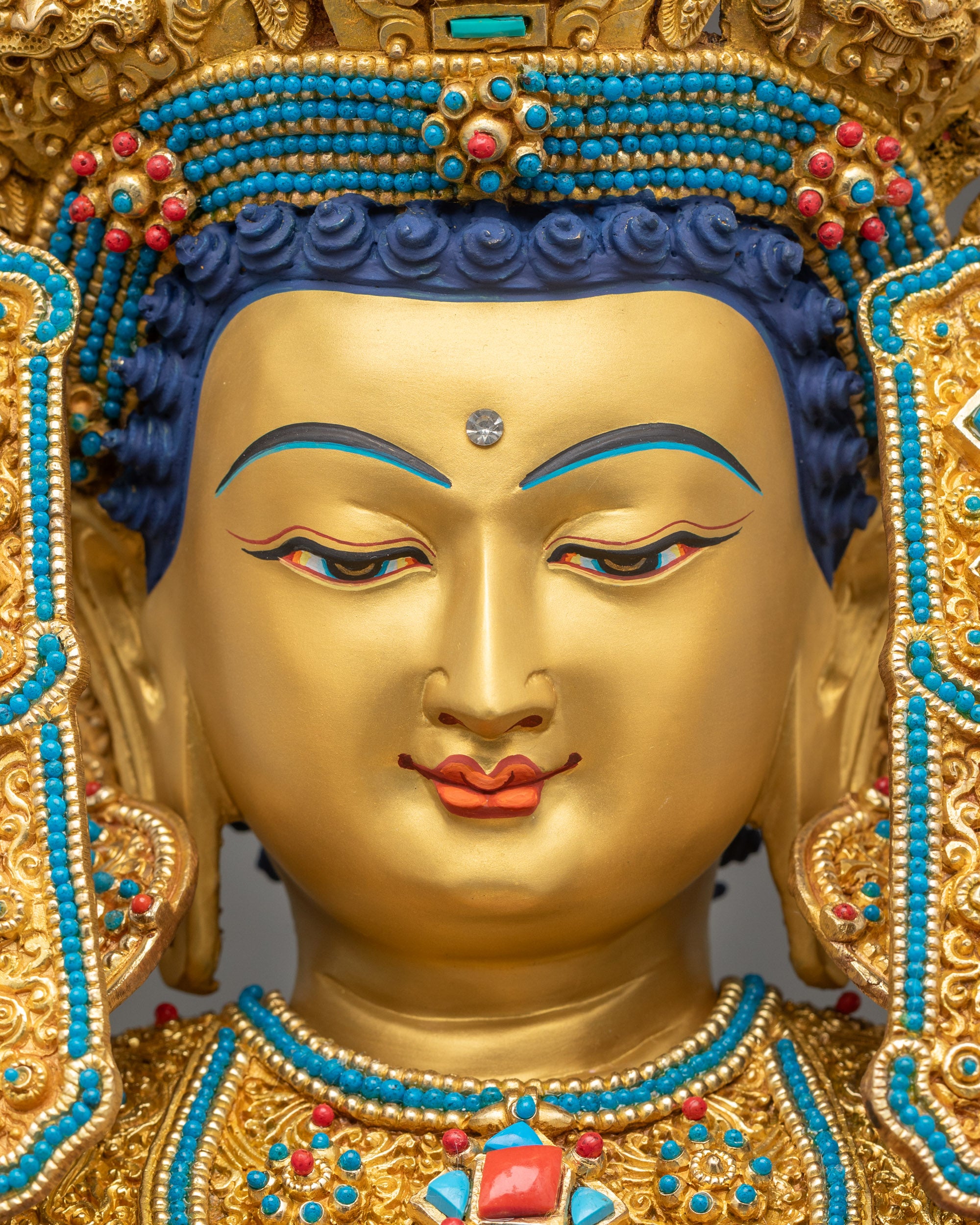 Detailed view of gold-gilded Dharma crown on Jowo Buddha Statue, handcrafted Nepalese spiritual sculpture.