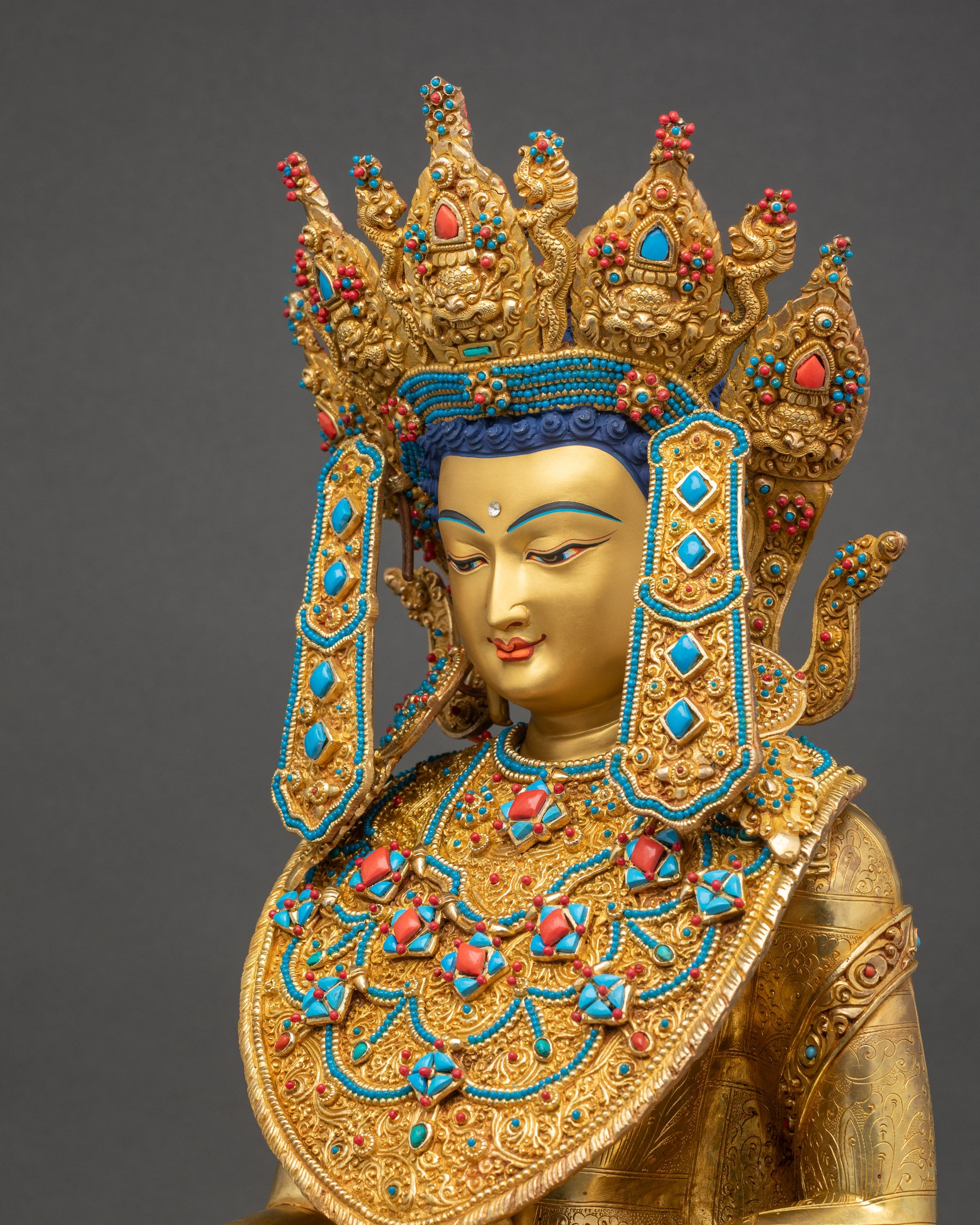 Detailed view of Jowo Buddha’s Kasaya robe with floral patterns, seated on lotus pedestal, gold-gilded copper.