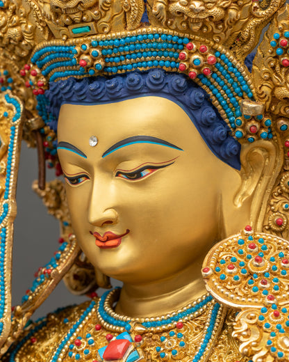 Close-up of Jowo Buddha Statue with semi-precious stone necklace and elongated earrings, symbolizing awakening.