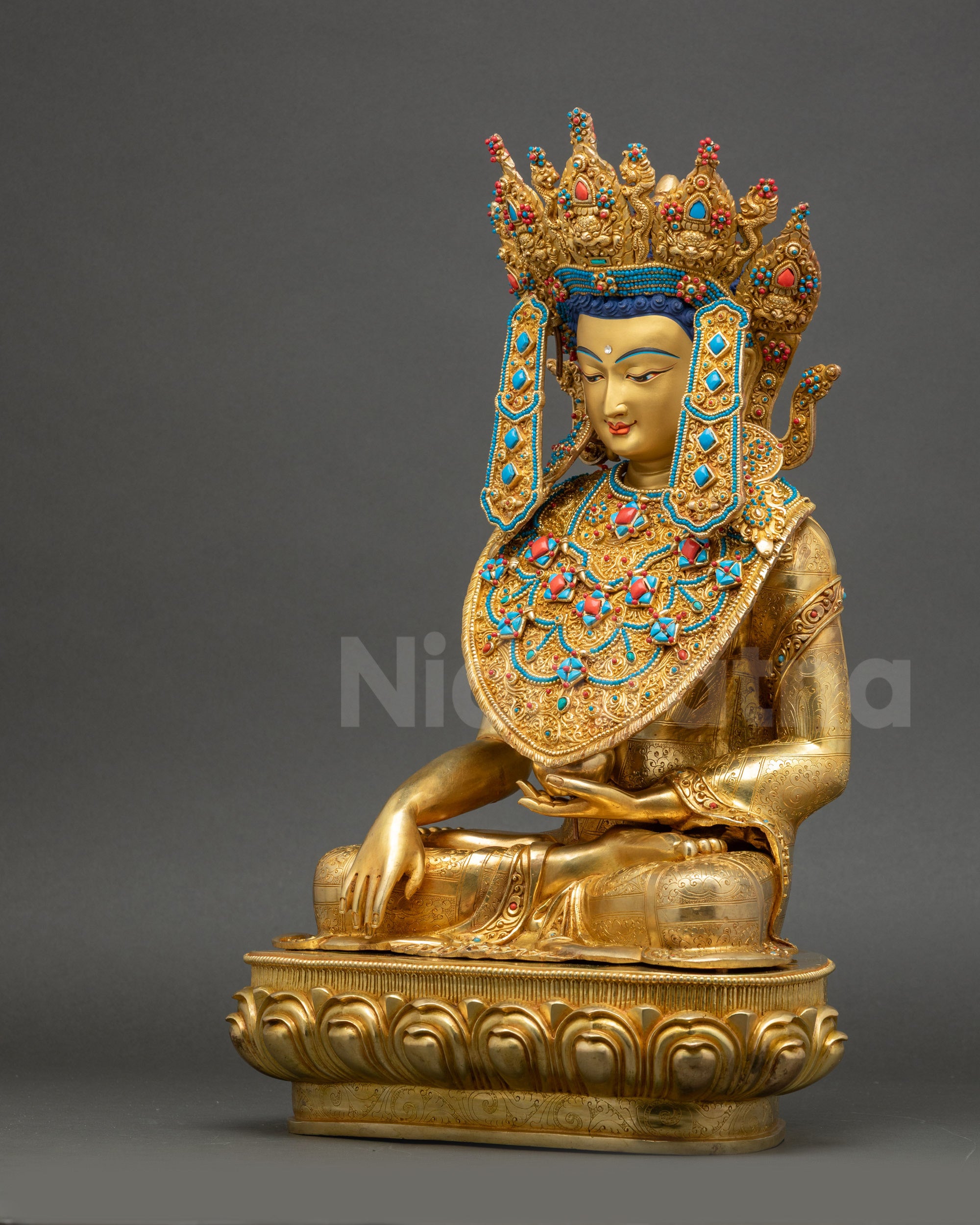 Left side of Jowo Buddha Statue, handcrafted in Nepal, gold-gilded copper with intricate floral Kasaya robe.