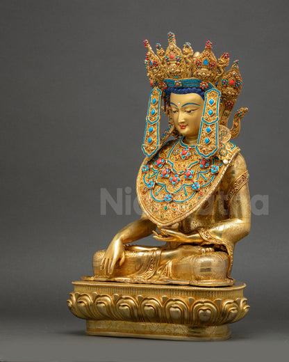 Left side of Jowo Buddha Statue, handcrafted in Nepal, gold-gilded copper with intricate floral Kasaya robe.