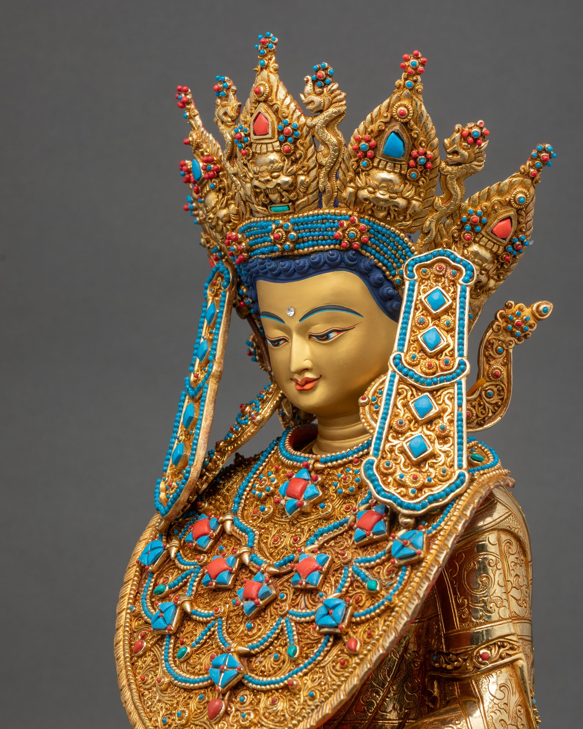 Detailed side close-up of Jowo Shakyamuni Rinpoche Statue showcasing intricate robe patterns, layered gold gilding
