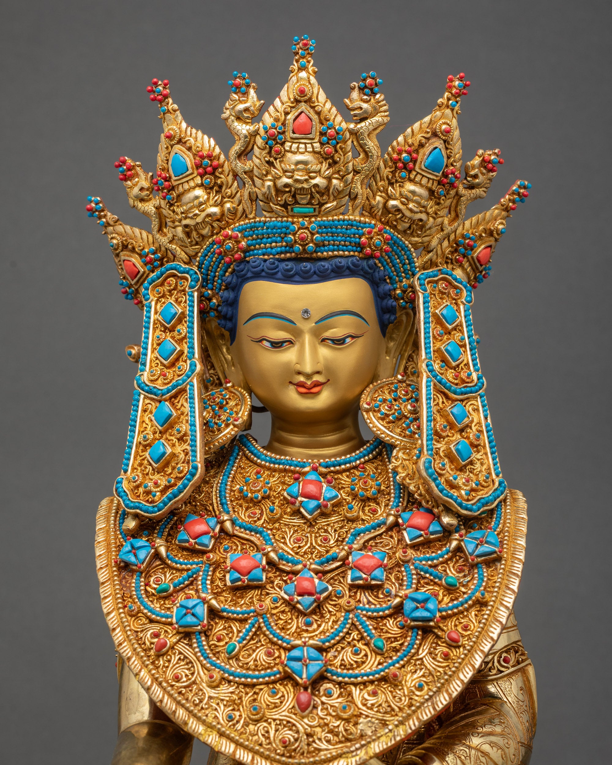 Intricate earrings and floral necklace on Jowo Shakyamuni Rinpoche statue