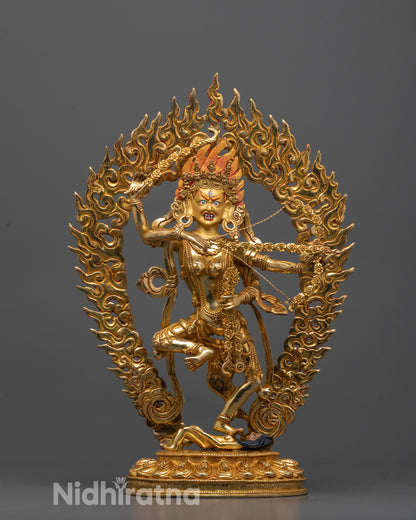 Kurukulla Statue front view with gold-gilded face and fierce stance on demon symbol
