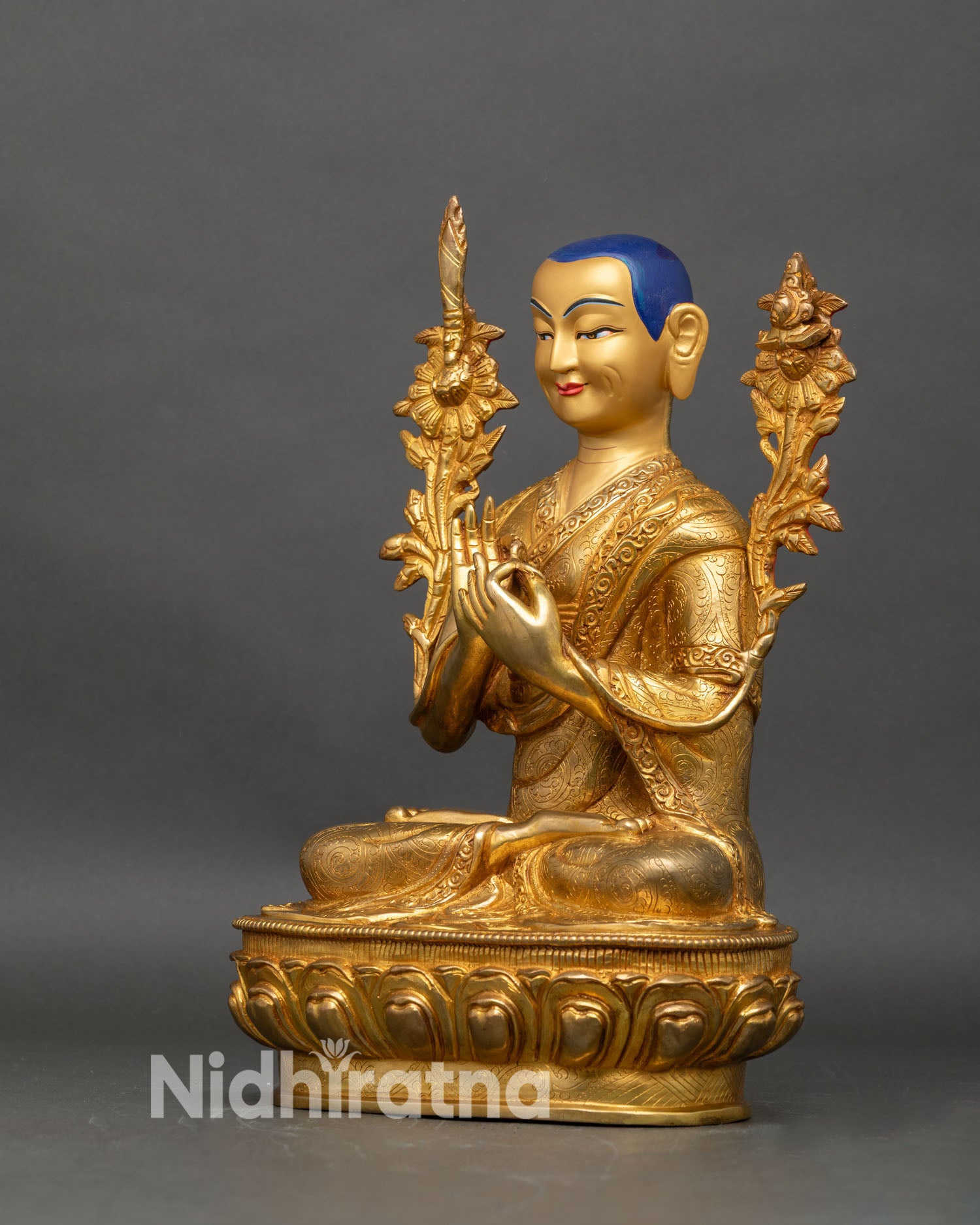 Left profile of Lama Tsongkhapa statue seated in Dharmachakra mudra on lotus throne