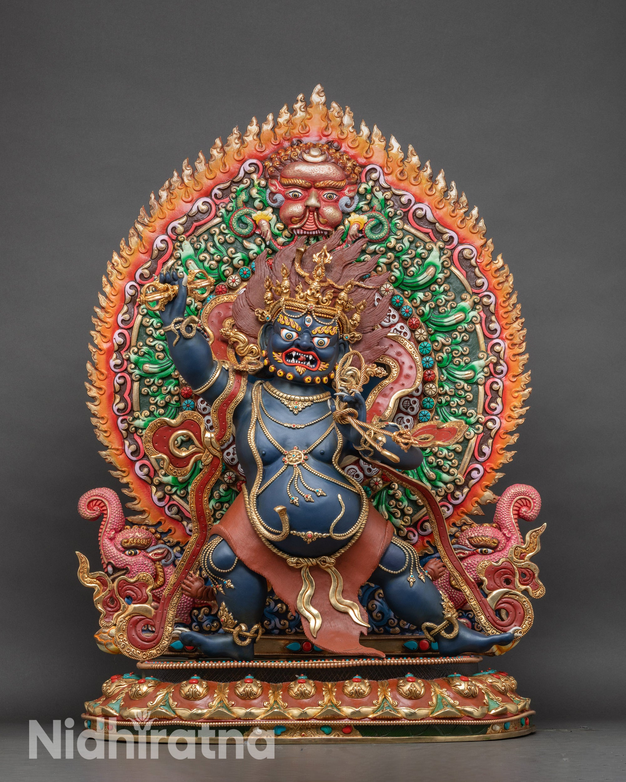 Large Vajrapani Bodhisattva statue standing on lotus pedestal, gold-gilded and adorned with semi-precious stones