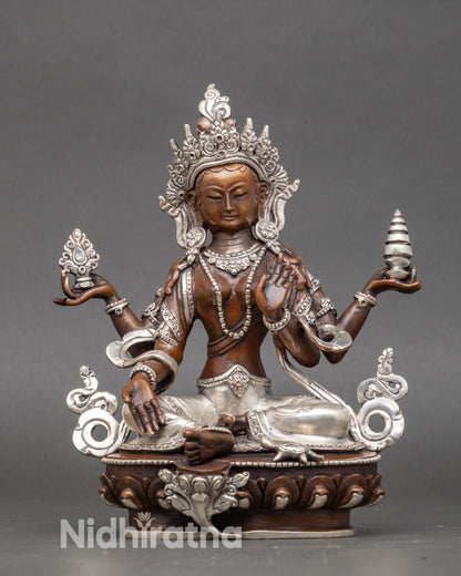 Laxmi Statue handcrafted by Newari artisan, silver-plated goddess seated on lotus throne