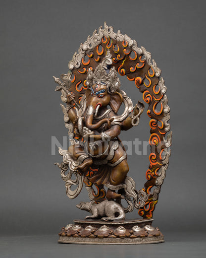 Left profile of dancing Ganesha statue with detailed halo and traditional Nepalese metalwork